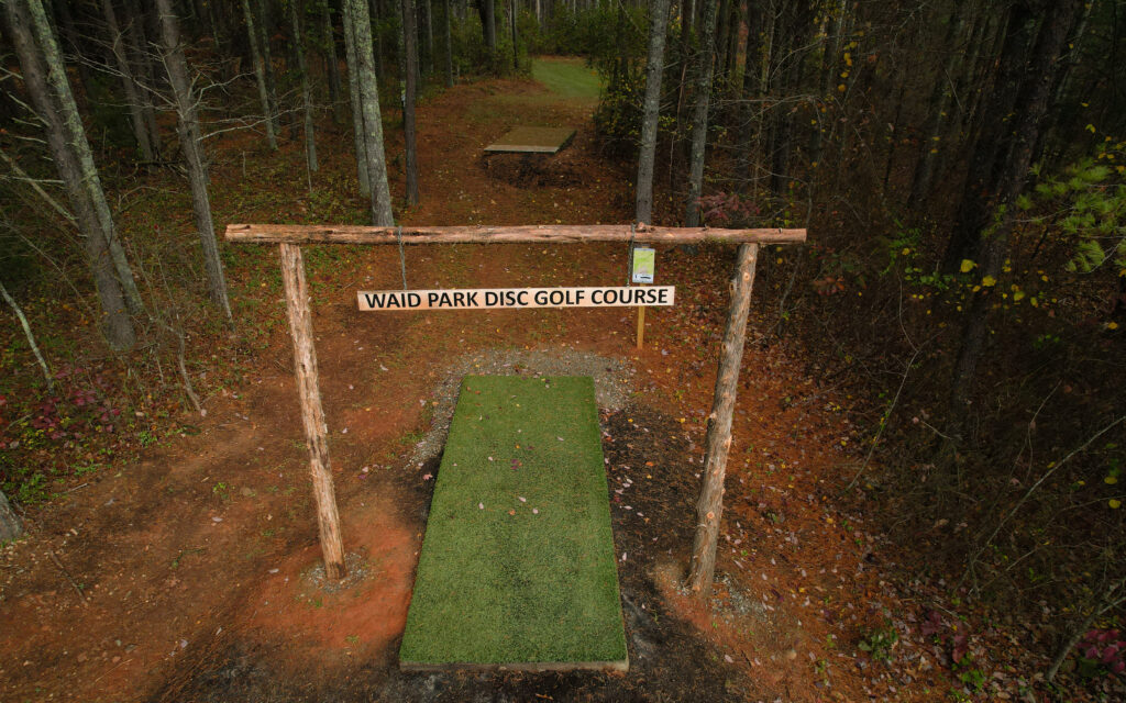 Drone image of the entrance sign to Waid Park Disc Golf Course